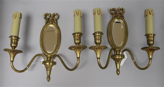 A pair of Louis XVI gilded bronze two branch mirrored sconces height 27cm